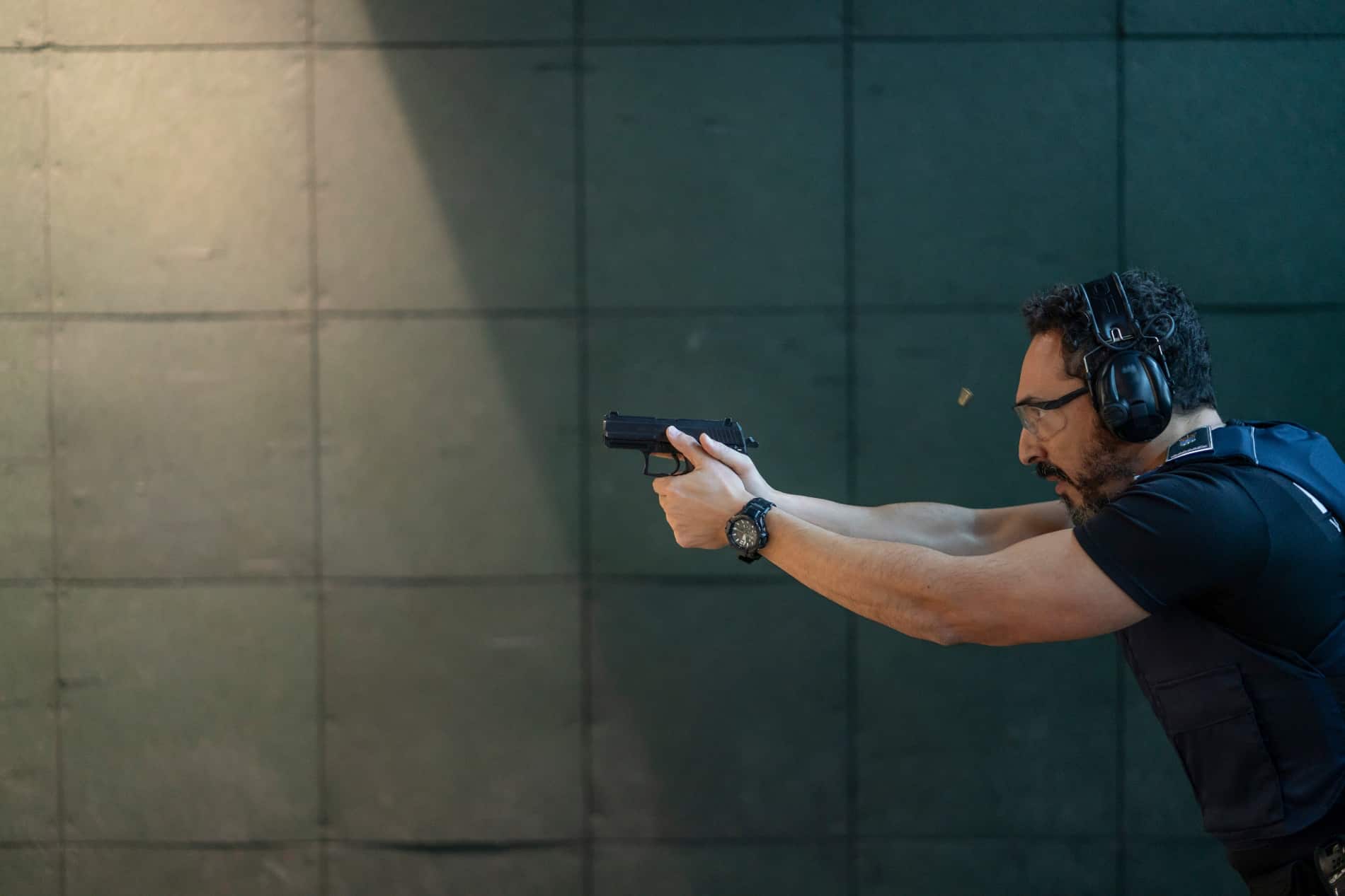 man holding hangun sideshot-stock