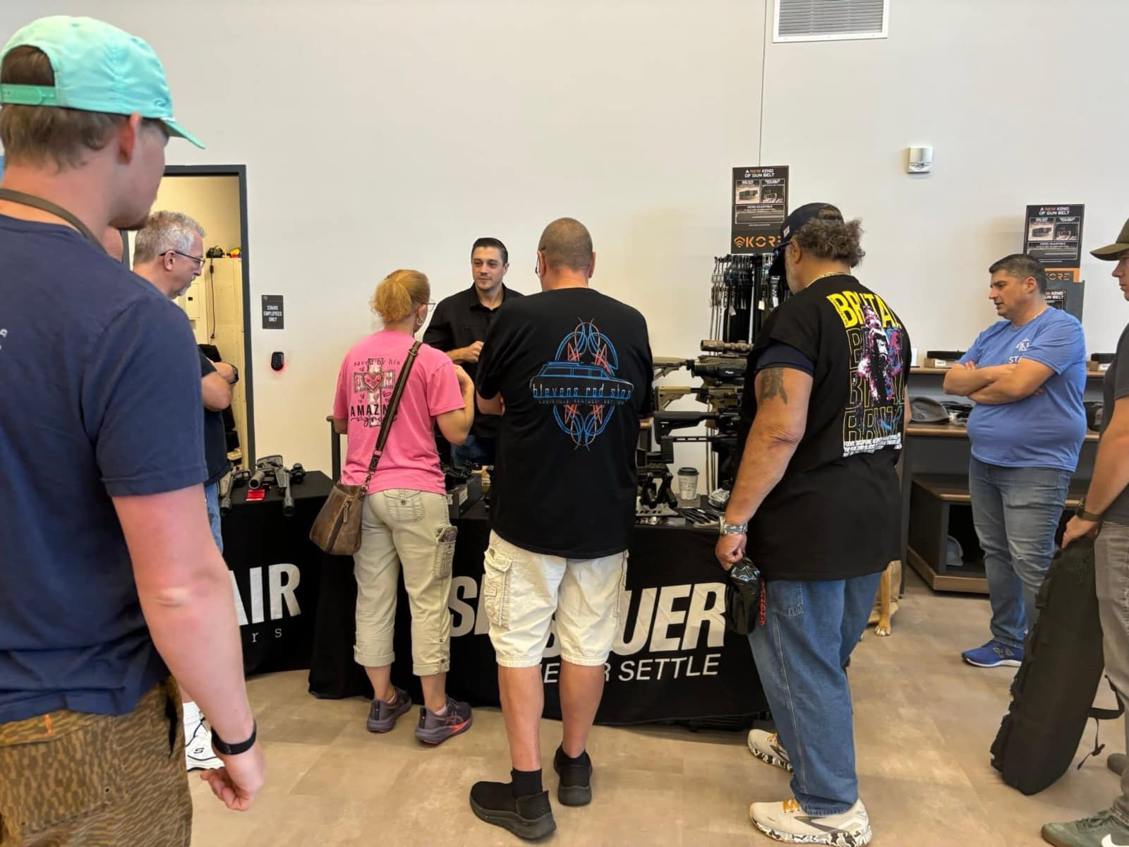 Attendees gathered around a vendor display during a previous Vendor Demo Day at Next Level Ranges