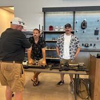 Vendor representatives discussing products with an attendee